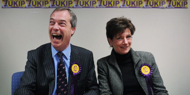UKIP leader Nigel Farage congratulates their candidate Diane James on coming second in the Eastleigh by-election after holding a news conference in the Hampshire town this morning.