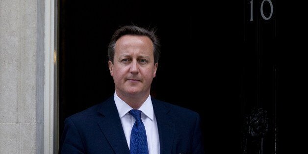 British Prime Minister David Cameron leaves 10 Downing Street in London on 18 June, 2014 preparing to meet Estonian Prime Minister Taavi Roivas. Prime Minister David Cameron warned on June 18 that militants making advances in Iraq and fighting in Syria were also planning to attack Britain. 'I'd disagree with those people who think this is nothing to do with us and if they want to have some sort of extreme Islamist regime in the middle of Iraq that won't affect us -- it will,' Cameron told the H