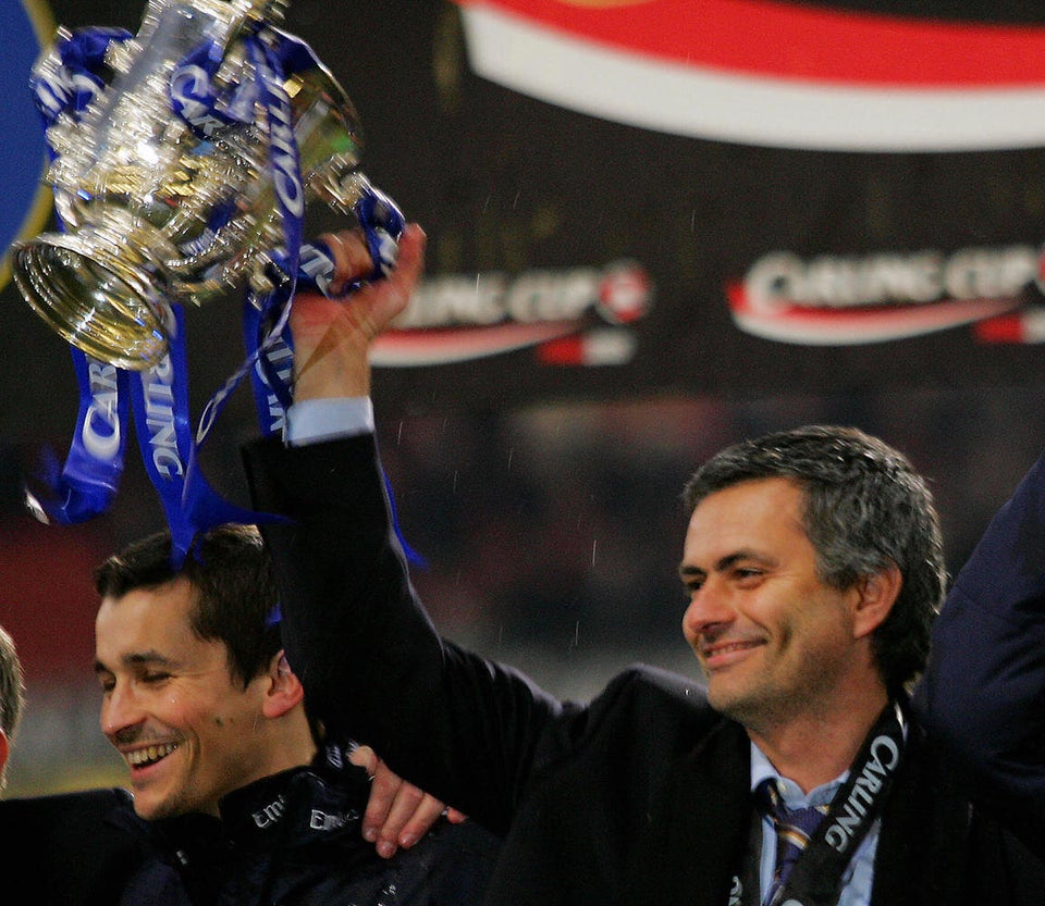 Chelsea's manager Jose Mourinho raises t