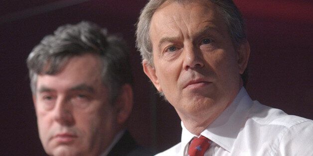 UNITED KINGDOM - APRIL 28: British Prime Minister Tony Blair, right, and U.K. Chancellor Gordon Brown listen at a press conference in London, Thursday, April 28, 2005. Blair pledged to open discussions with leaders of Britain's financial services industry on reducing regulation after the May 5 election, while declining to rule out increases in corporation taxes. (Photo by Andy Shaw/Bloomberg via Getty Images)