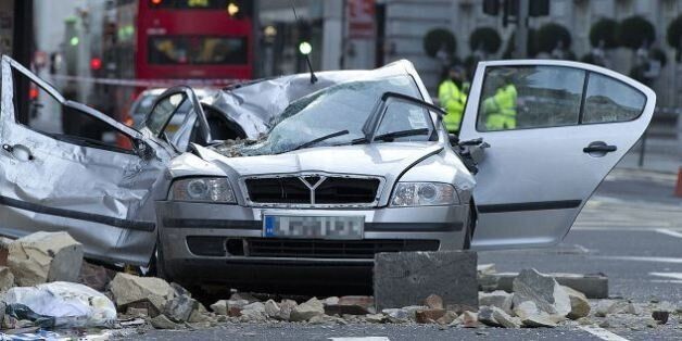 Car wrecked after masonry from a building collapsed