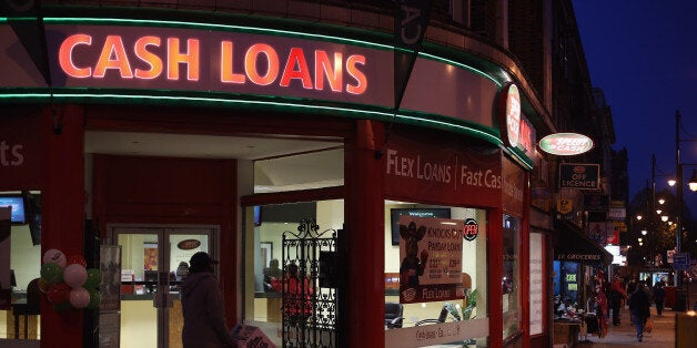 LONDON, ENGLAND - NOVEMBER 01: A general view of a 'Speedy Cash' cash loans shop on Brixton High Street on November 1, 2012 in London, England. The recession has changed the face of the UK's high streets, which have seen a boom in bookmakers, discount stores, charity shops, cheque cashing (payday loans) and pawnbrokers as cash-strapped Brits struggled with their finances. (Photo by Dan Kitwood/Getty Images)