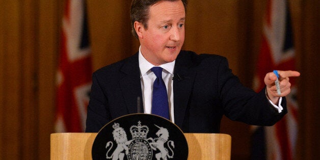 LONDON, UNITED KINGDOM - FEBRUARY 11: Britain's Prime Minister David Cameron addresses the media during a press conference at 10 Downing street on February 11, 2014 in London, England. Cameron held the press conference after returning from a tour of the flood hit areas of south-west England. (Photo by Ben Stansall/WPA Pool/Getty Images)