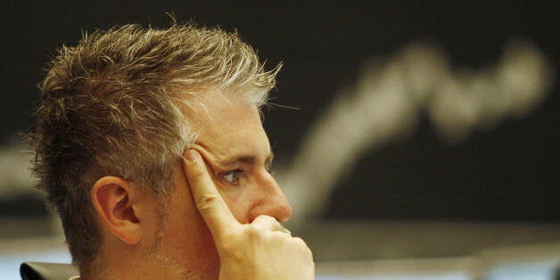 A stock trader watches the boards at the stock exchange in the central German city of Frankfurt/M. 16 August 2007. Europe's main stock markets plummeted with London and Paris shedding more than 3.0 percent, as renewed global credit jitters sent world share prices tumbling again. Frankfurt's DAX 30 dived 2.38 percent to 7,268.63 points and the DJ Euro Stoxx 50 index of eurozone shares slid 2.53 percent to 4,077.23 points. AFP PHOTO DDP/MARTIN OESER GERMANY OUT (Photo credit should read MARTIN O