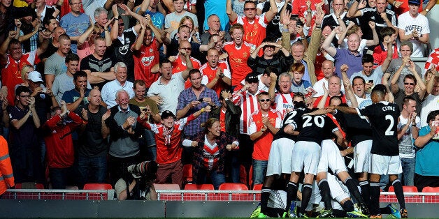 LIVERPOOL, ENGLAND - SEPTEMBER 21: (THE SUN OUT & THE SUN ON SUNDAY OUT) Dejan Lovren of Southampton clelebrates his goal during the Barclays Premier League match between Liverpool and Southampton at Anfield on September 21, 2013 in Liverpool, England. (Photo by John Powell/Liverpool FC via Getty Images)