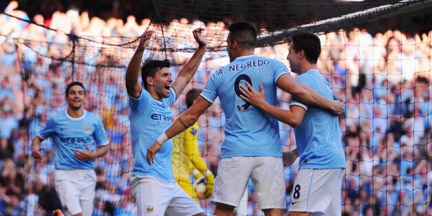 MANCHESTER, ENGLAND - SEPTEMBER 22: Sergio Aguero of Manchester City (L) celebrates with Alvaro Negredo (9) and Samir Nasri (8) as he scores their third goal during the Barclays Premier League match between Manchester City and Manchester United at the Etihad Stadium on September 22, 2013 in Manchester, England. (Photo by Michael Regan/Getty Images)