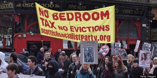 Protesters carry a Scottish Socialist Party banner on the anti bedroom tax protest in Glasgow