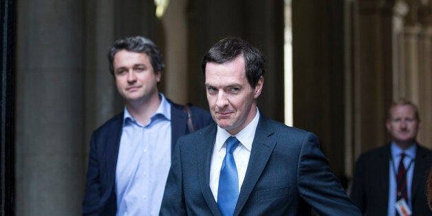 LONDON, ENGLAND - JULY 15: George Osborne (C), the Chancellor of the Exchequer, arrives in Downing Street on July 15, 2014 in London, England. British Prime Minister David Cameron is conducting a reshuffle of his Cabinet team with a greater number of women expected to be appointed to senior positions. (Photo by Oli Scarff/Getty Images)