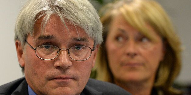 Andrew Mitchell and his wife Dr Sharon Bennett during a press conference in London, as he gives his reaction to the Crown Prosecution Service decision on the Plebgate row.