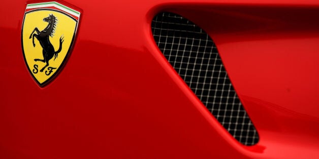 File photo dated 16/03/11 of a Ferrari badge on a car as the Italian supercar company raced to a record year in 2013 on the back of expanding UK sales.