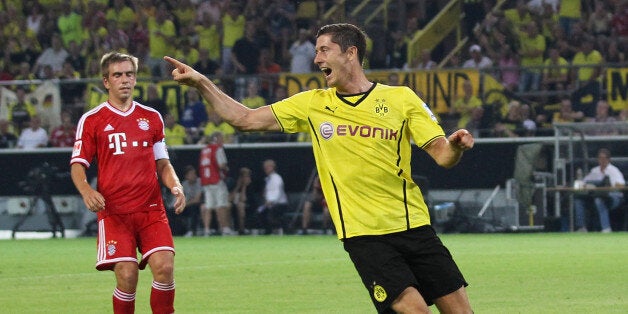 DORTMUND, GERMANY - JULY 27: Robert Lewandowski (R) of Dortmund celebrates during the DFL Supercup match between Borussia Dortmund and FC Bayern Muenchen at Signal Iduna Park on July 27, 2013 in Dortmund, Germany. (Photo by Boris Streubel/Getty Images)