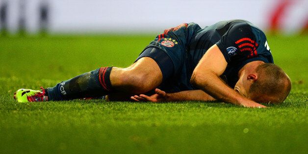 Arjen Robben lies injured