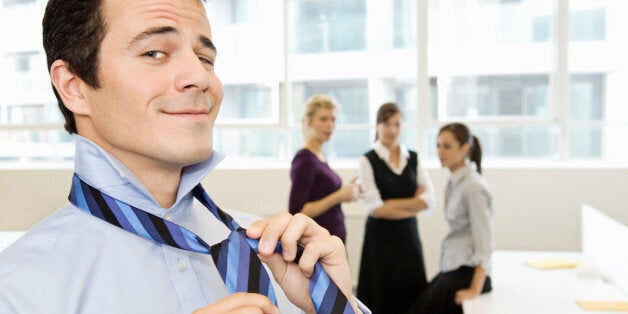 Businessman being watched by colleagues