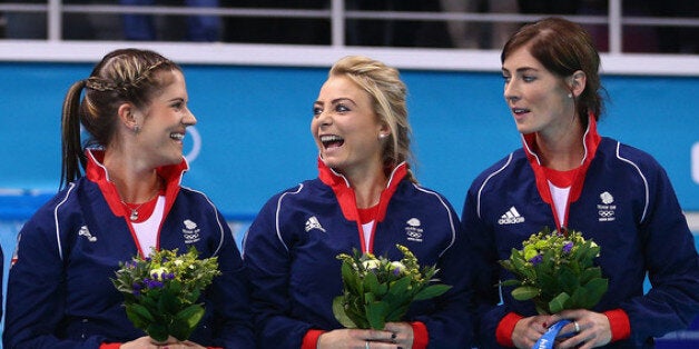 SOCHI, RUSSIA - FEBRUARY 20: (L-R) Lauren Gray, Claire Hamilton, Vicki Adams, Anna Sloan and Eve Muirhead of Great Britain celebrate during the flower ceremony for the Gold medal match between Sweden and Canada on day 13 of the Sochi 2014 Winter Olympics at Ice Cube Curling Center on February 20, 2014 in Sochi, Russia. (Photo by Clive Mason/Getty Images)