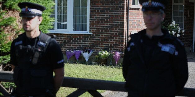 CLAYGATE, ENGLAND - SEPTEMBER 07: Police stand outside a house believed to belong to the al-Hilli family on September 7, 2012 in Claygate, England. French police are continuing to investigate a multiple murder after the bodies of three members of a British family were found in a bullet-riddled car in the French resort of Annecy. A 4-year-old girl, who had remained hidden for hours, was also found alive after investigators eventually entered the car. Local news agencies have named the male victi