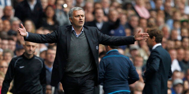 Chelsea's Portuguese manager Jose Mourinho gestures from the touchline during the English Premier League football match between Tottenham Hotspur and Chelsea at White Hart Lane in London on September 28, 2013. AFP PHOTO/ IAN KINGTON RESTRICTED TO EDITORIAL USE. NO USE WITH UNAUTHORIZED AUDIO, VIDEO, DATA, FIXTURE LISTS, CLUB/LEAGUE LOGOS OR LIVE SERVICES. ONLINE IN-MATCH USE LIMITED TO 45 IMAGES, NO VIDEO EMULATION. NO USE IN BETTING, GAMES OR SINGLE CLUB/LEAGUE/PLAYER PUBLICATIONS (P