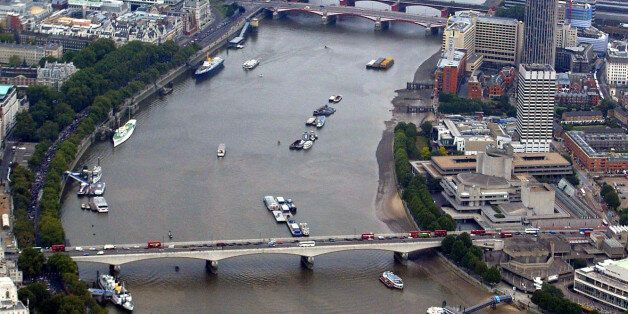 Aerial shot looking down the river Thames, in central London, including Hungerford Bridge, Charing Cross Station, the City, Waterloo Bridge, Blackfriars Bridge, South Bank Arts Centre.