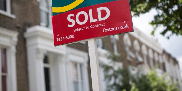 LONDON, ENGLAND - JUNE 03: An estate agent sold sign is displayed outside a property on June 3, 2014 in London, England. Figures from the Nationwide, the UK's largest building society, have shown that in the year to May, the annual rise in house prices was 11.1% which represents the greatest rate of increase in seven years. (Photo by Oli Scarff/Getty Images)