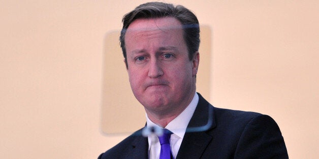 British Prime Minister David Cameron stands behind a teleprompter as he delivers a speech on Scottish independence in the Olympic Park in east London February 7, 2014. British Prime Minister David Cameron urged people in all parts of the United Kingdom to try to persuade Scots to vote 'no' in their referendum on independence. With just seven months to go until the September 18 vote, Cameron will reach out to people in England, Wales and Northern Ireland, which he said would be 'deeply diminishe