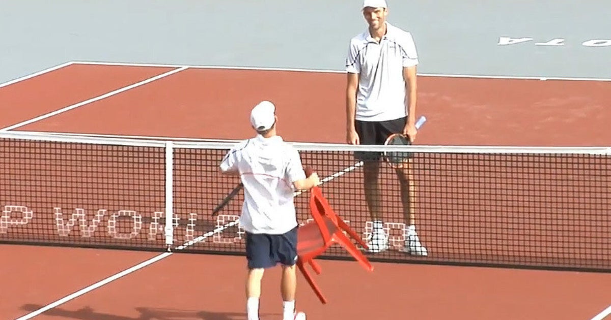 Tennis Player Dudi Sela Uses Chair To Congratulate Ivo Karlovic At(02)