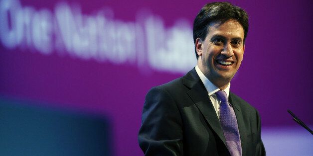 Britain's opposition Labour Party leader Ed Miliband gestures during a Question and answer session during the conclusion of the final day of the Labour party conference in Brighton, Sussex, south England on September 25, 2013. Britain's opposition Labour leader Ed Miliband positioned himself as the champion of hard-pressed working families, using a speech to his party's annual conference to promise a freeze on energy prices and higher wages. AFP PHOTO / ADRIAN DENNIS (Photo credit shoul