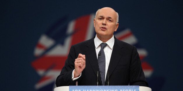 MANCHESTER, ENGLAND - OCTOBER 01: Iain Duncan Smith, the Secretary of State for Work and Pensions, delivers his speech in the Main Hall of Manchester Central on the third day, and penultimate day, of the Conservative Party Conference on October 1, 2013 in Manchester, England. David Cameron has unveiled a Government pilot scheme for GP surgeries to open from 8am until 8pm seven days, backed by 50 million GBP of funding. (Photo by Oli Scarff/Getty Images)