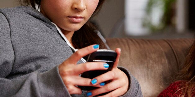 Teenage girl looking at cellphone