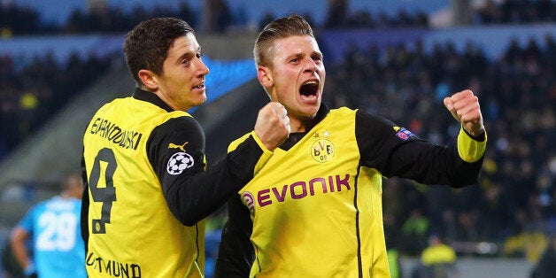 Lewandowski celebrates his first goal with Łukasz Piszczek