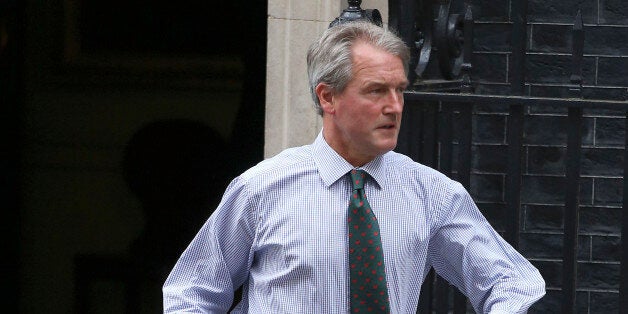 Secretary of State for Environment, Food and Rural Affairs, Owen Paterson leaves 10 Downing Sreet in central London after a cabinet meeting.