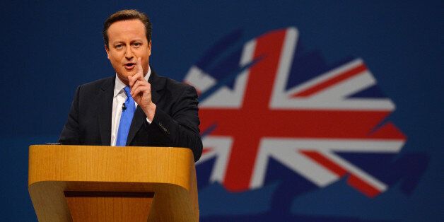British Prime Minister David Cameron addresses delegates at the annual Conservative Party Conference in Manchester, north-west England, on October 2, 2013. AFP PHOTO / PAUL ELLIS (Photo credit should read PAUL ELLIS/AFP/Getty Images)