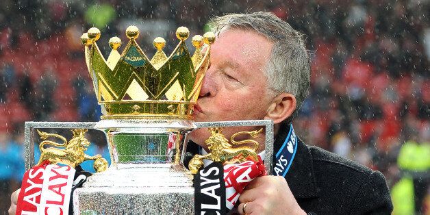CROPPED VERSION Manchester United's Scottish manager Alex Ferguson kisses the Premier League trophy at the end of the English Premier League football match between Manchester United and Swansea City at Old Trafford in Manchester, northwest England, on May 12, 2013. Ferguson said farewell to Old Trafford with a typically passionate speech after his side's 2-1 victory over Swansea in his final home match in charge of the team. AFP PHOTO / ANDREW YATES RESTRICTED TO EDITORIAL USE. No use with unau