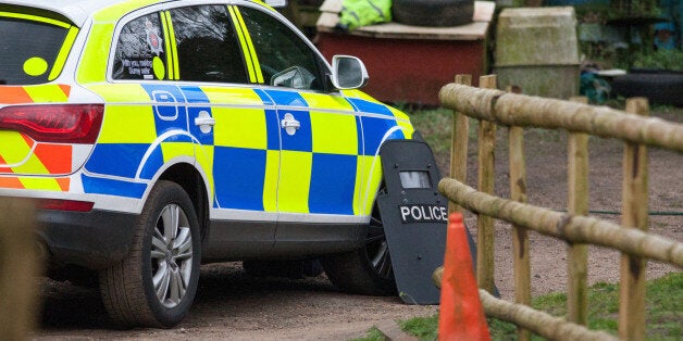 Police at the scene at Keepers Cottage Stud in Waverley Lane, Farnham, Surrey, where two women and four dogs were found shot dead yesterday morning after gunshots were heard, as a 82-year-old man is being questioned over the killings.