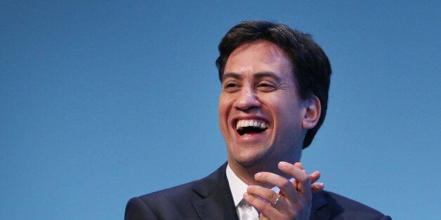 BRIGHTON, ENGLAND - SEPTEMBER 25: Party leader Ed Miliband laughs during a speech by deputy leader Harriet Harman (unseen) during the Labour Party conference on September 25, 2013 in Brighton, England. Mr Miliband took part in a question and answer session on the last day of conference. (Photo by Peter Macdiarmid/Getty Images)