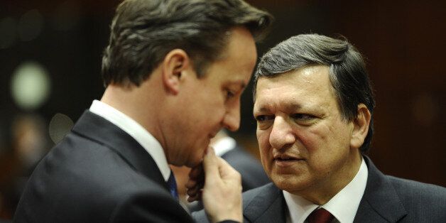 British Prime Minister David Cameron (L) and European Commission President Jose Manuel Barroso talk prior to a meeting of European Union leaders in Brussels on May 23, 2012. Europe's leaders are expected to shift their focus from austerity to growth at a summit Wednesday amid accelerating worries over Greece's eurozone future and Spain's troubled banks. AFP PHOTO / LIONEL BONAVENTURE (Photo credit should read LIONEL BONAVENTURE/AFP/GettyImages)