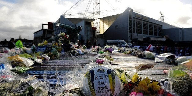 Tributes are laid outside Deepdale Stadium in memory of Sir Tom Finney