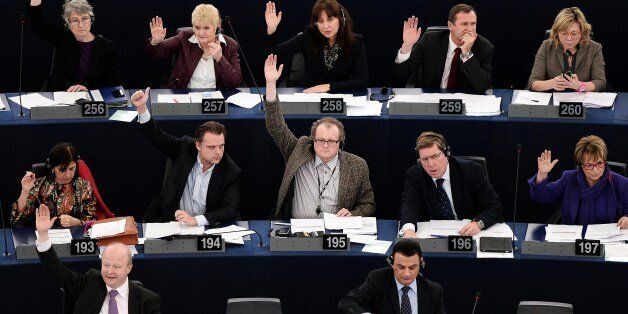 Members of the European Union parliament take part in a vote during a plenary session at the European Parliament in Strasbourg, eastern France, on February 26, 2014. AFP PHOTO / FREDERICK FLORIN (Photo credit should read FREDERICK FLORIN/AFP/Getty Images)
