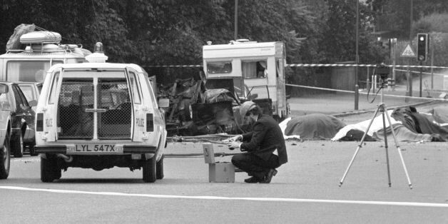 File photo dated 20/07/82 of a police photographer at the scene of the car bomb, in which four soldiers died, in Hyde Park, London, as the prosecution of the Hyde Park bombing suspect John Downey has collapsed after a "reckless" error led to him being given a false assurance that he was not wanted by British police over the IRA attack, it can now be reported.