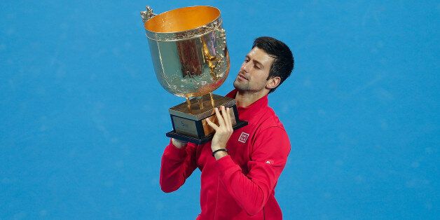 BEIJING, CHINA - OCTOBER 06: Novak Djokovic of Serbia poses with his trophy during the medal ceremony after winning the Men's Single Final of the China Open at the China National Tennis Center on October 6, 2013 in Beijing, China. (Photo by Lintao Zhang/Getty Images)