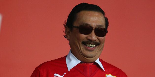 CARDIFF, WALES - DECEMBER28: Sri Vincent Tan the owner of Cardiff City looks on from the directors box ahead of the Barclays Premier League match between Cardiff City and Sunderland at the Cardiff City Stadium on December 28, 2013 in Cardiff, Wales. (Photo by Michael Steele/Getty Images)