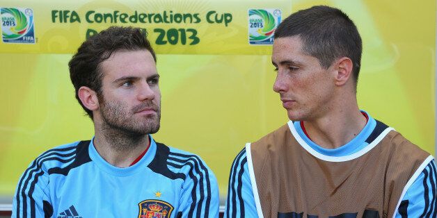 FORTALEZA, BRAZIL - JUNE 23: Juan Mata and Fernando Torres of Spain look on prior to the FIFA Confederations Cup Brazil 2013 Group B match between Nigeria and Spain at Castelao on June 23, 2013 in Fortaleza, Brazil. (Photo by Clive Rose/Getty Images)