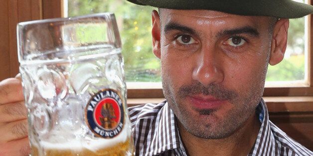 MUNICH, GERMANY - OCTOBER 06: Pep Guardiola, head coach of Bayern Muenchen attends with his wife Christina Guardiola the Oktoberfest 2013 beer festival at Kaefers Wiesenschaenke on October 6, 2013 in Munich, Germany. (Photo by Alexander Hassenstein/Bongarts/Getty Images)