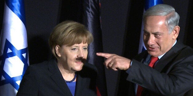 In this video-grab, German Chancellor Angela Merkel (L) and Israeli Prime Minister Benjamin Netanyahu...