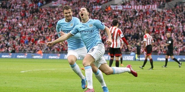 Manchester City's Samir Nasri (centre) celebrates scoring their second goal of the game