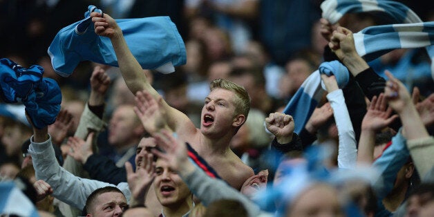 LONDON, ENGLAND - MARCH 02: Manchester City fans cheer during the Capital One Cup Final between Manchester City and Sunderland at Wembley Stadium on March 2, 2014 in London, England. (Photo by Jamie McDonald/Getty Images)