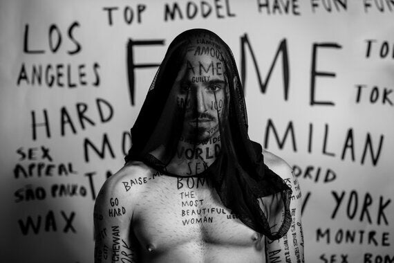 Model Vin Los with words tattooed on his FACE lands Garçon Model