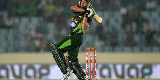 Pakistani batsman Shahid Afridi plays a shot during the eighth match of the Asia Cup one-day cricket tournament between Bangladesh and Pakistan at the Sher-e-Bangla National Cricket Stadium in Dhaka on March 4, 2014. AFP PHOTO/Dibyangshu SARKAR (Photo credit should read DIBYANGSHU SARKAR/AFP/Getty Images)