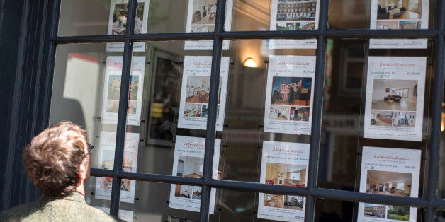 LONDON, ENGLAND - JUNE 03: A man looks at property details displayed in the window of an estate agent in Camden on June 3, 2014 in London, England. Figures from the Nationwide, the UK's largest building society, have shown that in the year to May, the annual rise in house prices was 11.1% which represents the greatest rate of increase in seven years. (Photo by Oli Scarff/Getty Images)