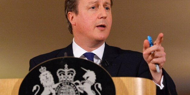 Britain's Prime Minister David Cameron addresses the media during a press conference in 10 Downing street in central London on February 11, 2014. British Prime Minister David Cameron he was cancelling a planned trip to Israel and the Palestinian territories next week to deal with devastating floods in England. At a press conference about the floods that have affected huge swathes of southern England, the prime minister said he would continue to take personal command of the crisis. AFP PHOTO / PO