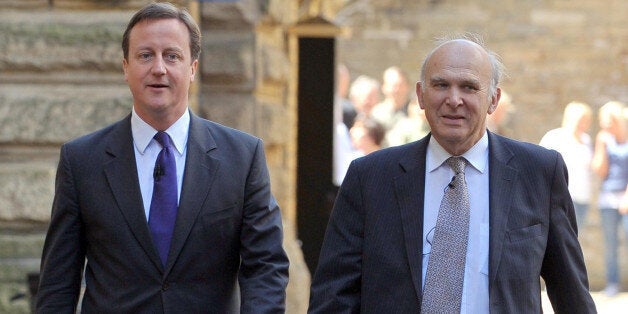 British Prime Minister David Cameron arrives with Business Secretary Vince Cable to speak to members of the local business community at PACE in Shipley, West Yorkshire, where Cameron set out the Government's strategy for economic growth.