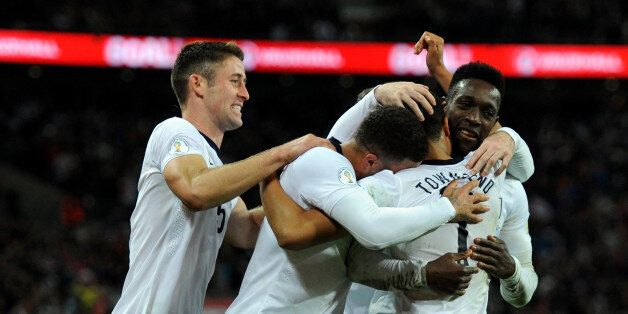 LONDON, ENGLAND - OCTOBER 11: Andros Townsend of England is congratulated by teammates after scoring his team's third goal during the FIFA 2014 World Cup Qualifying Group H match between England and Montenegro at Wembley Stadium on October 11, 2013 in London, England. (Photo by Steve Bardens - The FA/The FA via Getty Images)